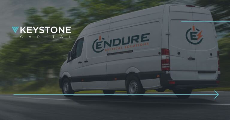 An Endure Critical Solutions service van driving down a road with the Keystone Capital logo overlayed.